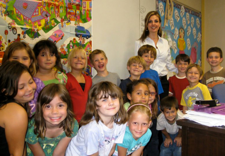 Samantha Blyn with some of the Junior Achievement kids she works with through her nonprofit organization, Making the Difference Outreach.